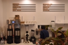 The various coffee options are on the back wall, above the batch brewer.