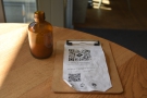 To business. You'll find a QR Code which leads to the online menu on each table.
