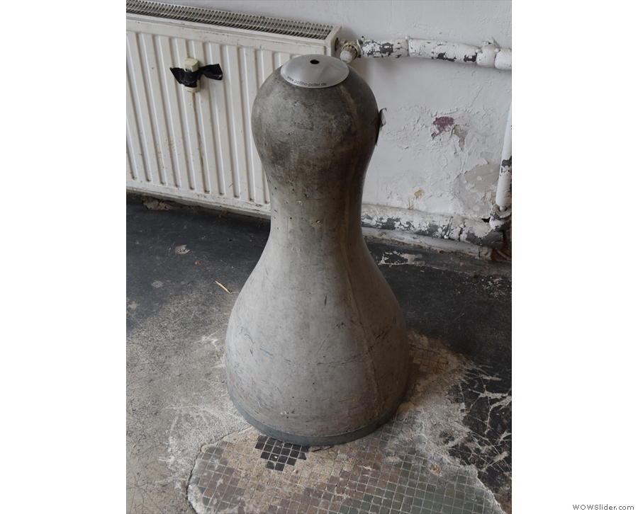 This was just inside the door. I wonder if it's a concrete sculpture of a coffee tamper?