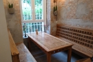... where you'll find this gorgeous table with a pair of benches. It's the best seat in the...