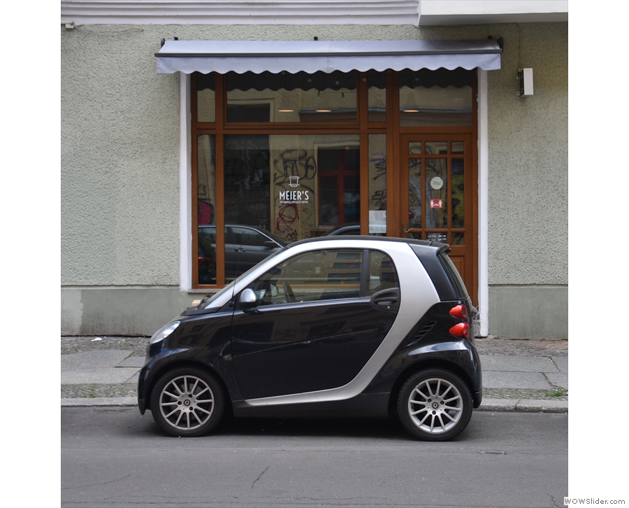 You know your shop is small when a two-seat Smart Car can completely block it!