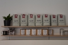 There are also bags of coffee for sale, displayed at the back of the shop.