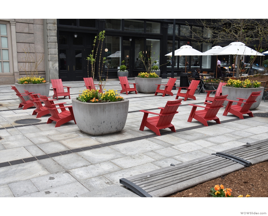 There's plenty more seating out here, including these 12 red, wooden deck chairs...