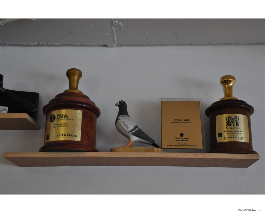 ... and one of two shelves holding all the barista championship trophies 3FE has won!