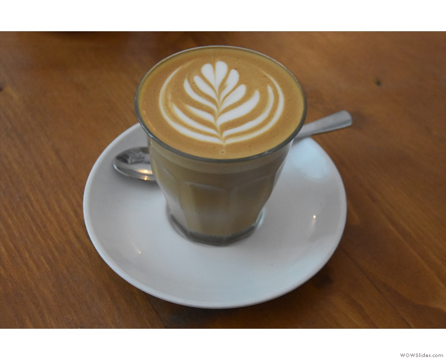 On my first visit, I started with a flat white, served in a glass...