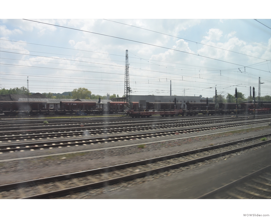 ... we left the station. The train runs through the Aachen suburbs...