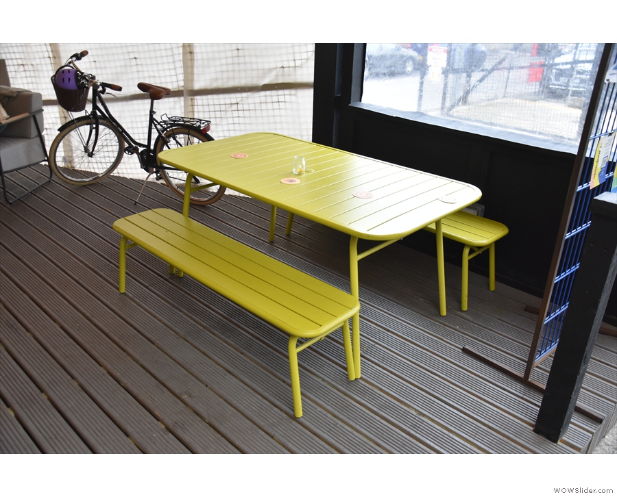 ... this yellow table with benches at the front...
