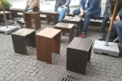 There's a plain, wooden table right in the middle of the space, but all the other tables...