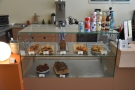 The cakes and pastries are in this large glass display case at the end of the counter.