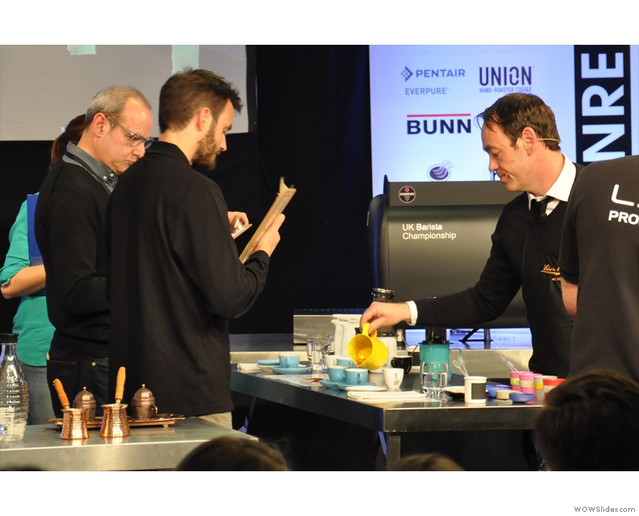 Gwilym dispenses his coffee to the judges.