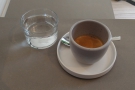 Back to my coffee (which wasn't the one we saw extracting). Served with a glass of water...