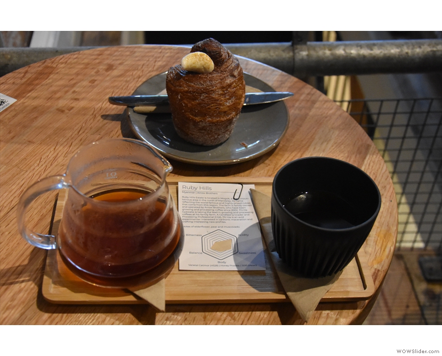 My coffee came in its server, presented on a small wooden tray along with a HuskeeCup.