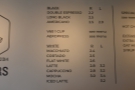 The drinks menu, meanwhile, is on the wall behind the counter, coffee on the left.