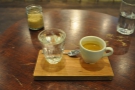 My 3FE espresso, beautifully presented on this wooden tray with a glass of water.