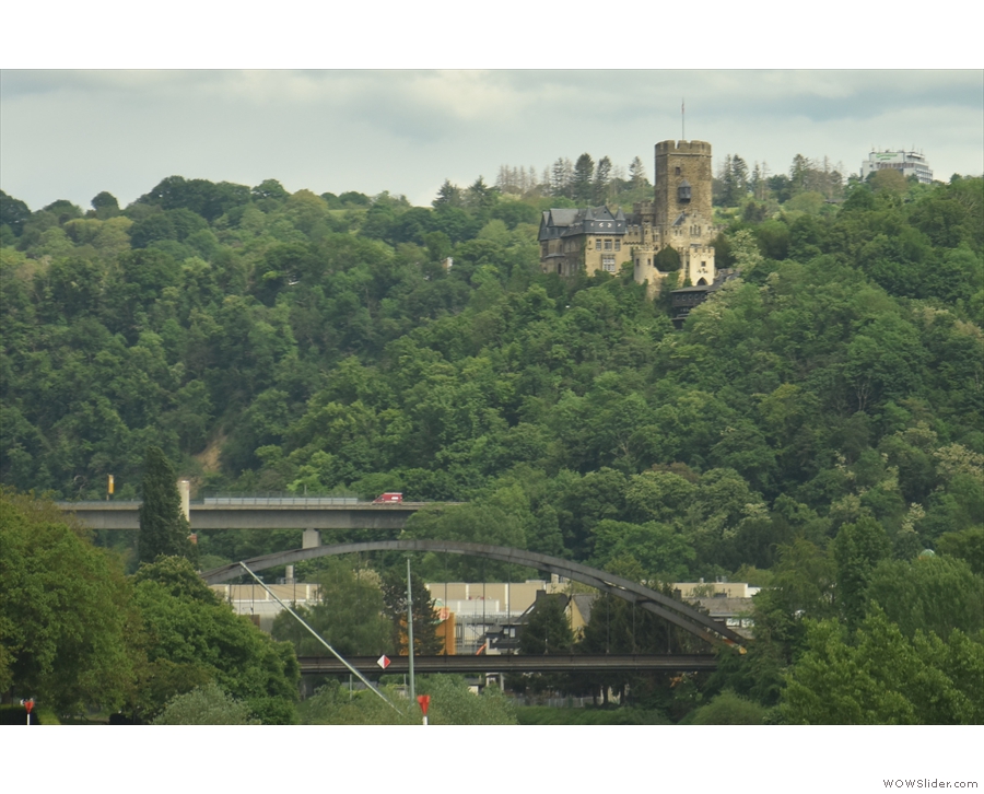... the castle on the hill, overlooking the Lahn, a small tributary of the Rhine, is...