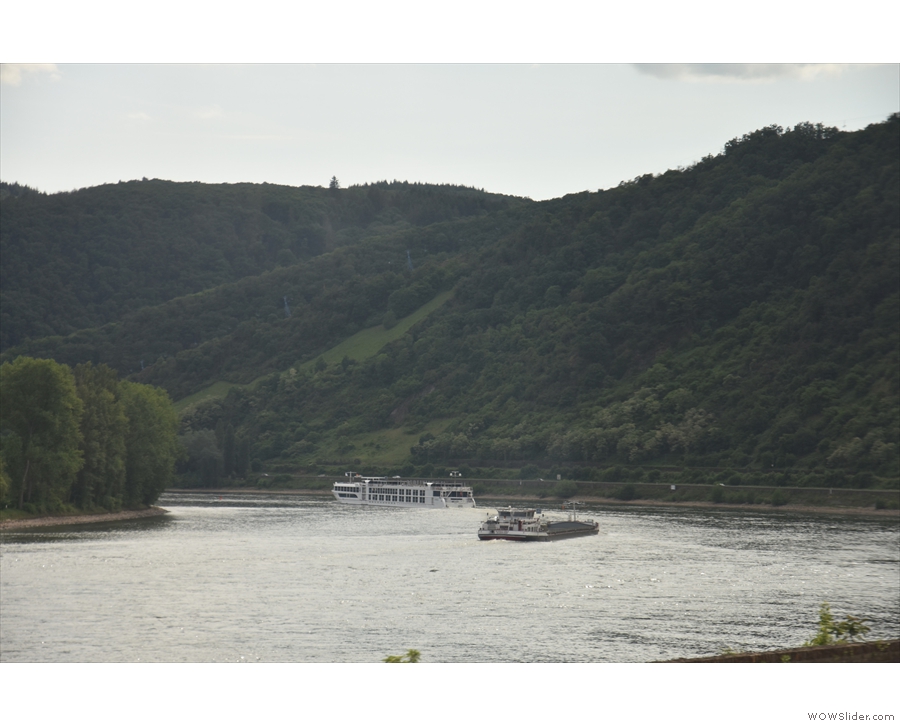 ... more river traffic, including a barge and a large tour boat.