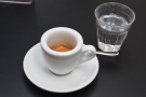 I decided to have an espresso, served in a classic white cup with a glass of water.