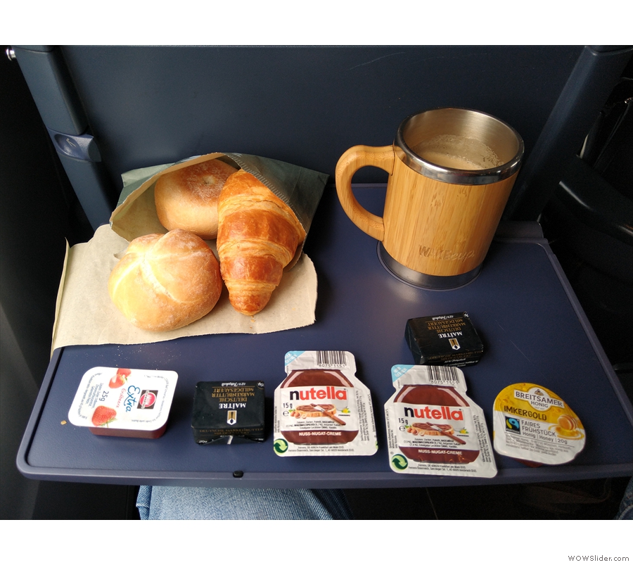 ... and took it back to my seat. The criossant and rolls were warm, while the coffee is...