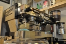 The doughnut-eye view of the La Marzocco; check out those bottomless portafilters.