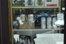 There's also a selection of coffee kit in the window behind the price list.