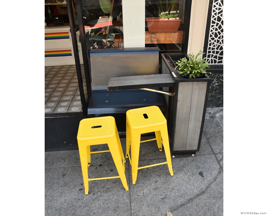 The outdoor seating is limited to two of these narrow tables, each with two stools...