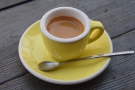 The espresso was served in a bright, yellow cup, made with the Little Brother blend...