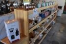 Although the counter is opposite the door, this line of retail shelves leads you to the...