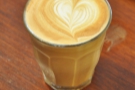 The final output: a decaf piccolo with superb latte-art.