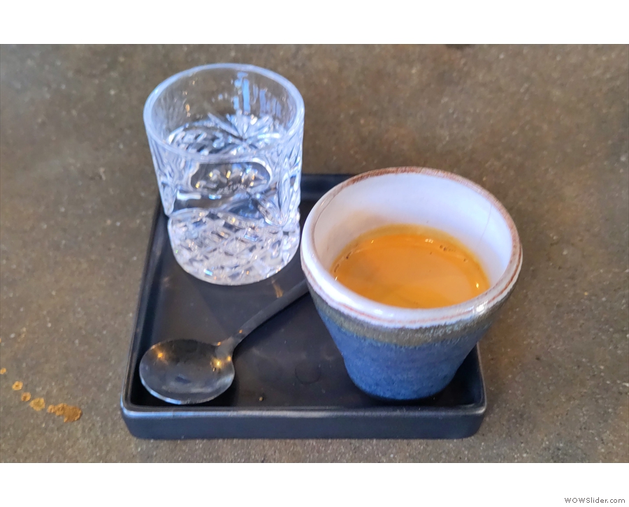 My espresso was served in a beautiful handless cup, with a glass of sparkling water...