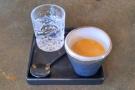 My espresso was served in a beautiful handless cup, with a glass of sparkling water...