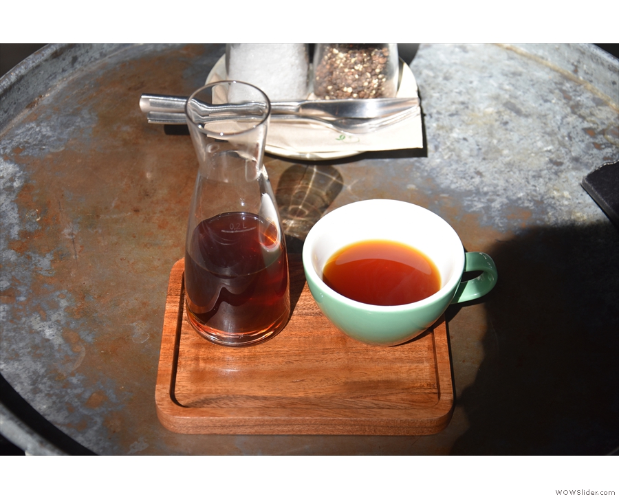 ... a cup on the side, all presented on a small, wooden tray.