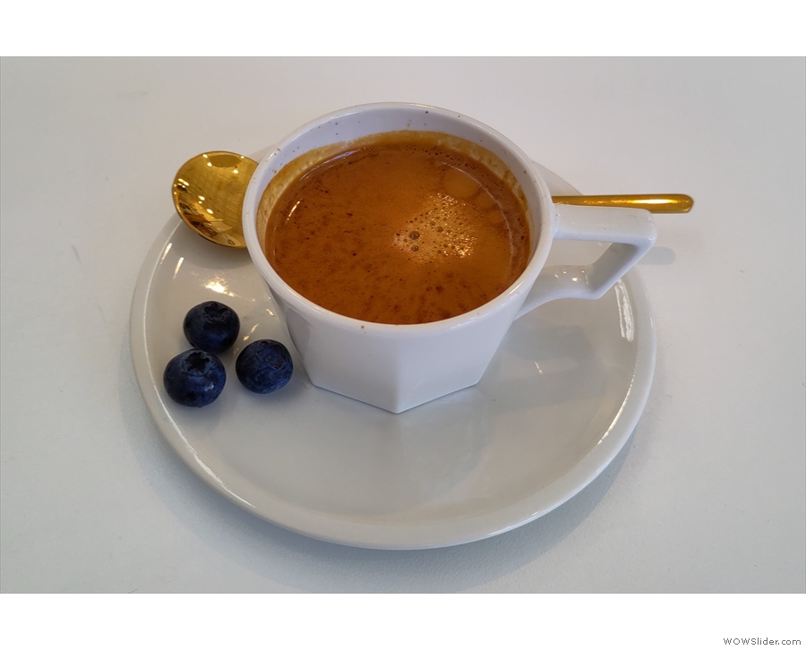 My espresso in more detail, served with three blueberries as palate cleansers.