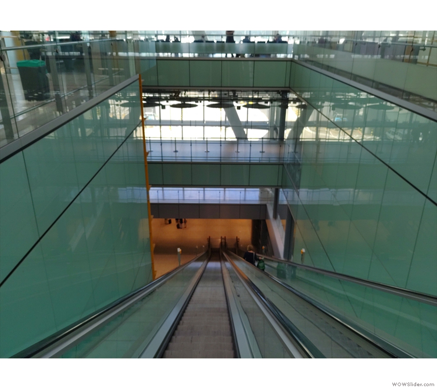 ... and head down this amazing escalator to get to the C block satellite terminal.