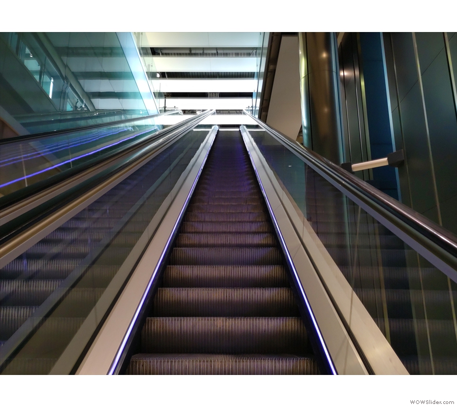 I like to take the escalators if I can. The first one goes all the way to ground level...