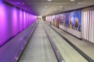 The long tunnel has a series of moving walkways (which are bi-directional!).