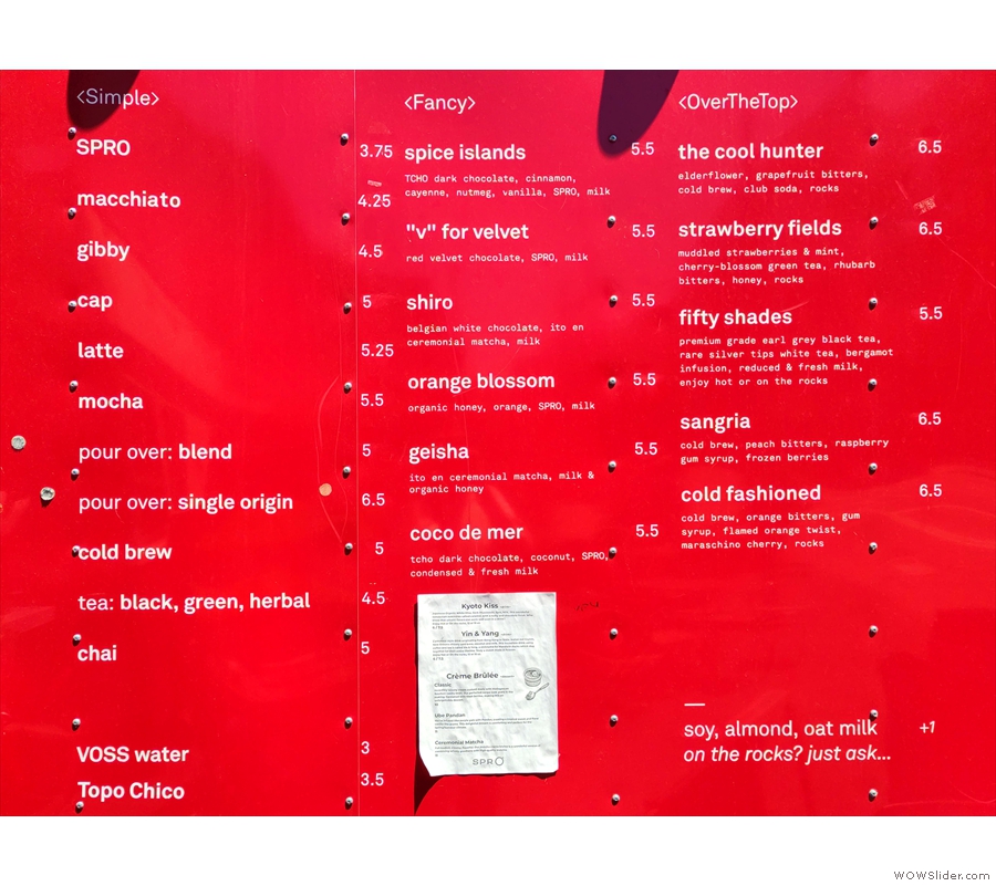 ... the drinks menu written up on the side. There's also a separate paper menu for the...