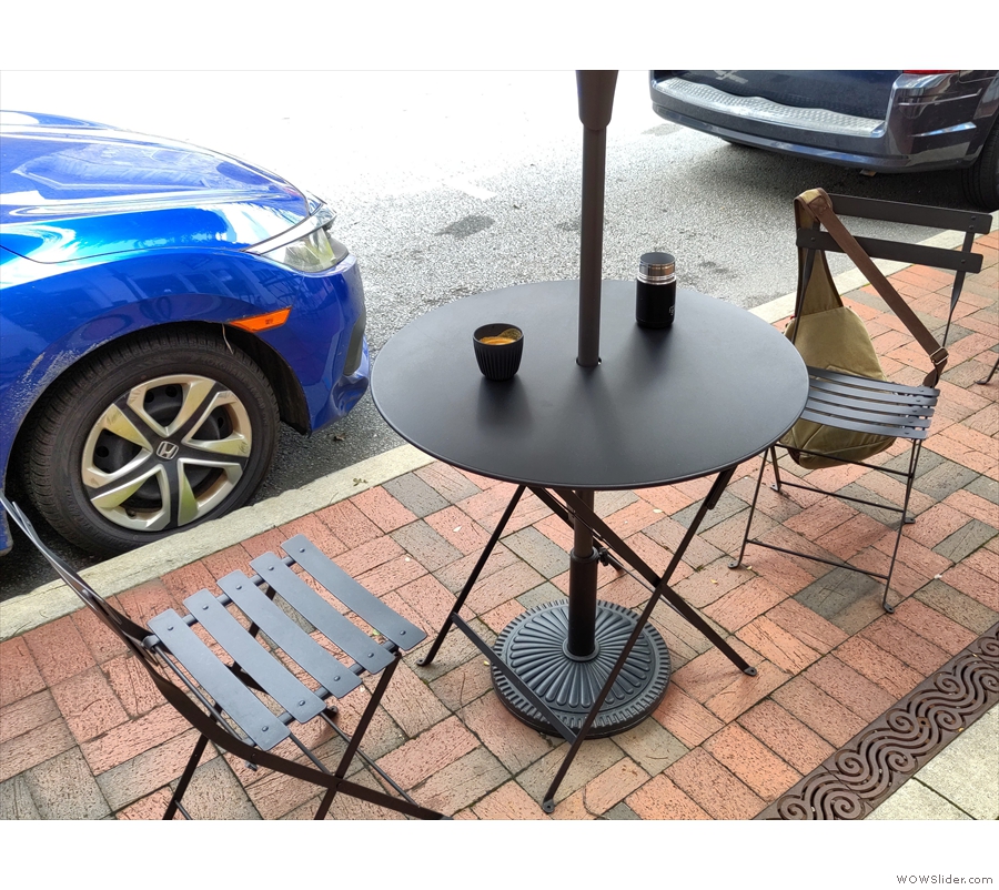 There's plenty of outside seating, including four of these two-person tables on the...