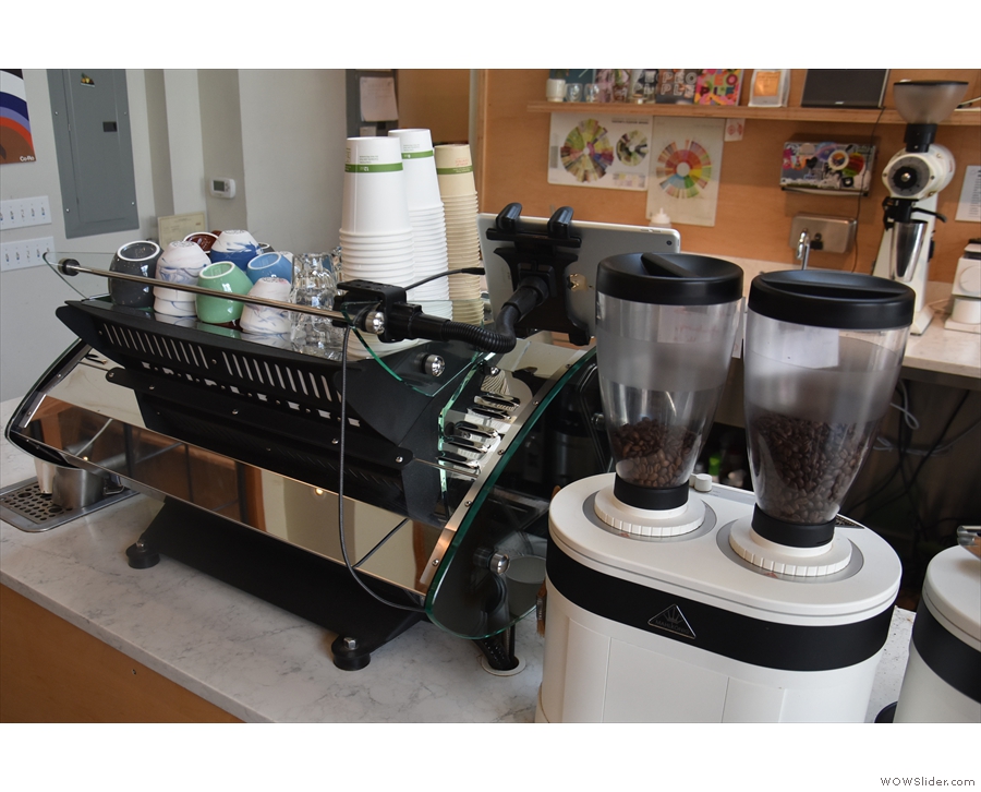 To the left is the espresso machine, a Kees van der Westen Mirage, and its grinders...