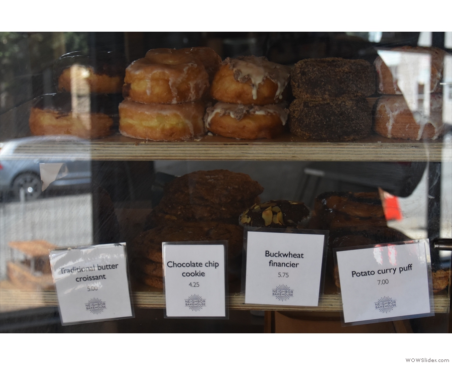 Moving along, the cakes and pastries are in this display case next to the coffee...