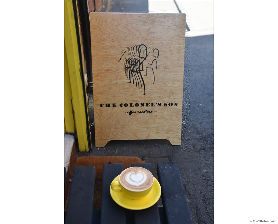 I'll leave you with a shot of my flat white admiring the A-board from the end of the bench.
