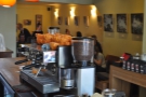 A view across the counter of the seating area at the back. That's my friend Kate hiding behind the coffee grinder...