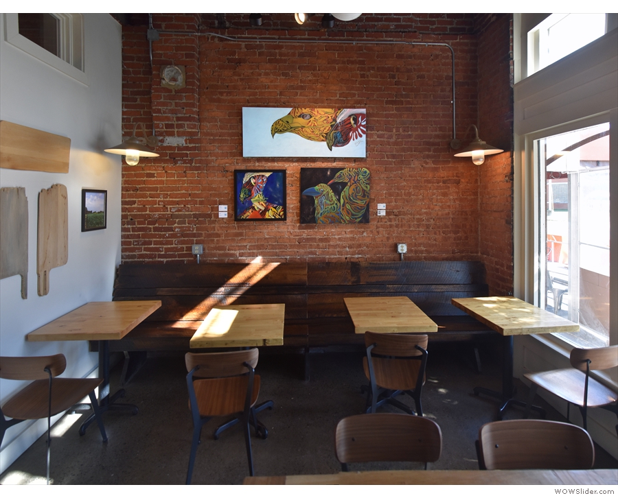 ... and ends with these four tables at the far end against the exposed brick wall.