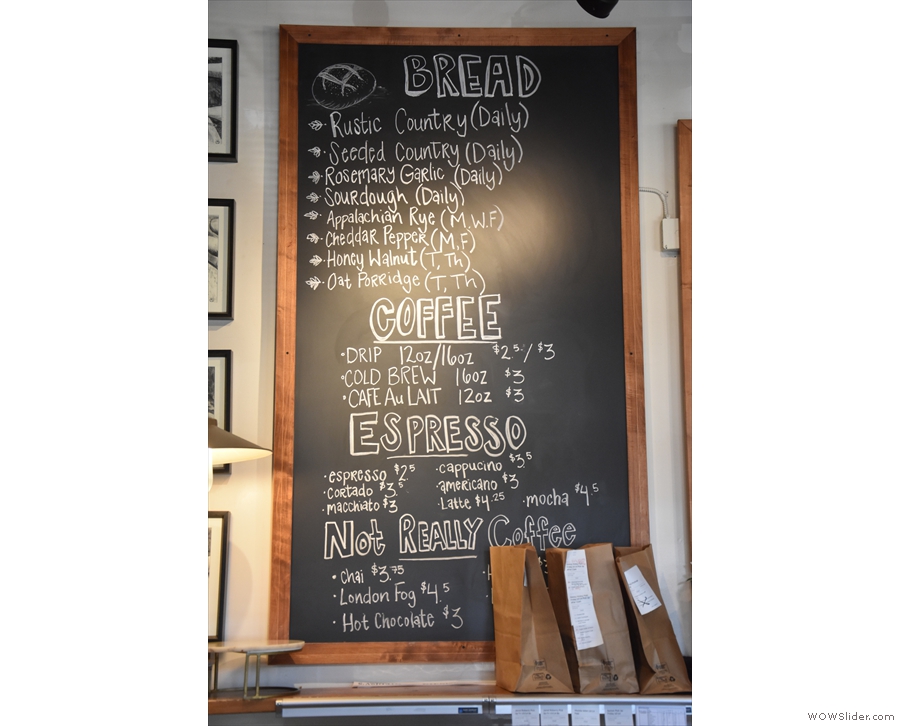 The bread schedule is on the menu board behind the counter, along with the coffee...