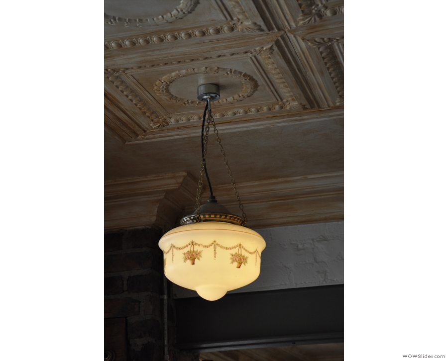 An example of one of the lights hanging from the panelled ceiling...