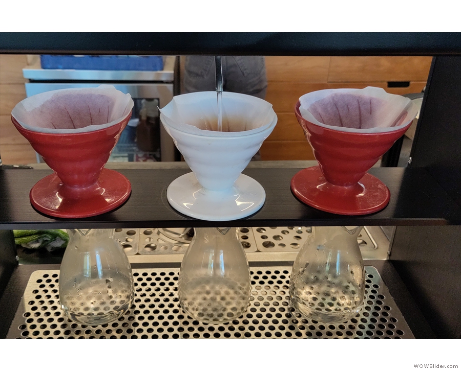 ... a manual pour-over, starting with the rinsing of the filter papers.
