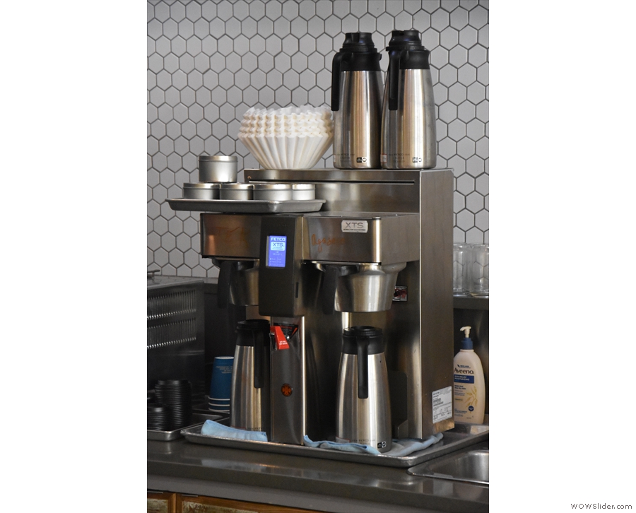 Batch brew filter, which changes daily, is on the back of the counter, while...