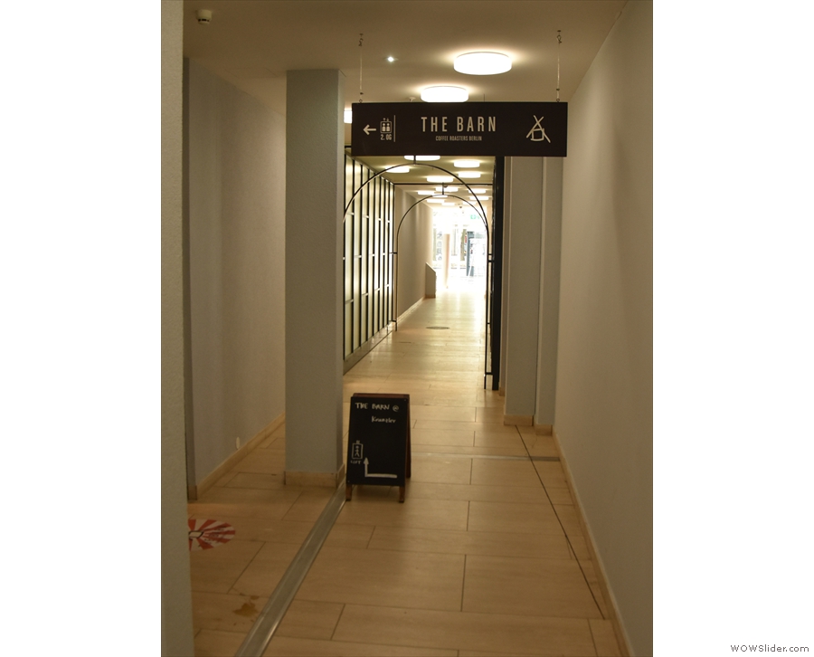 The sign leads to a corridor, where, halfway down on the left, you'll find the lift.