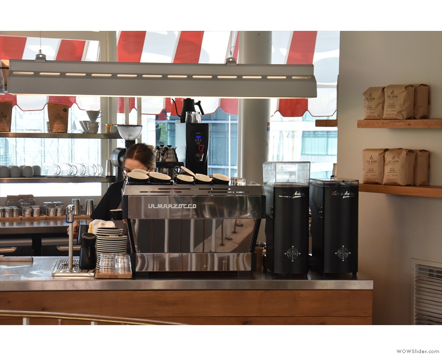 The La Marzocco Linea espresso machine and its twin grinders are on the right...
