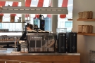 The La Marzocco Linea espresso machine and its twin grinders are on the right...