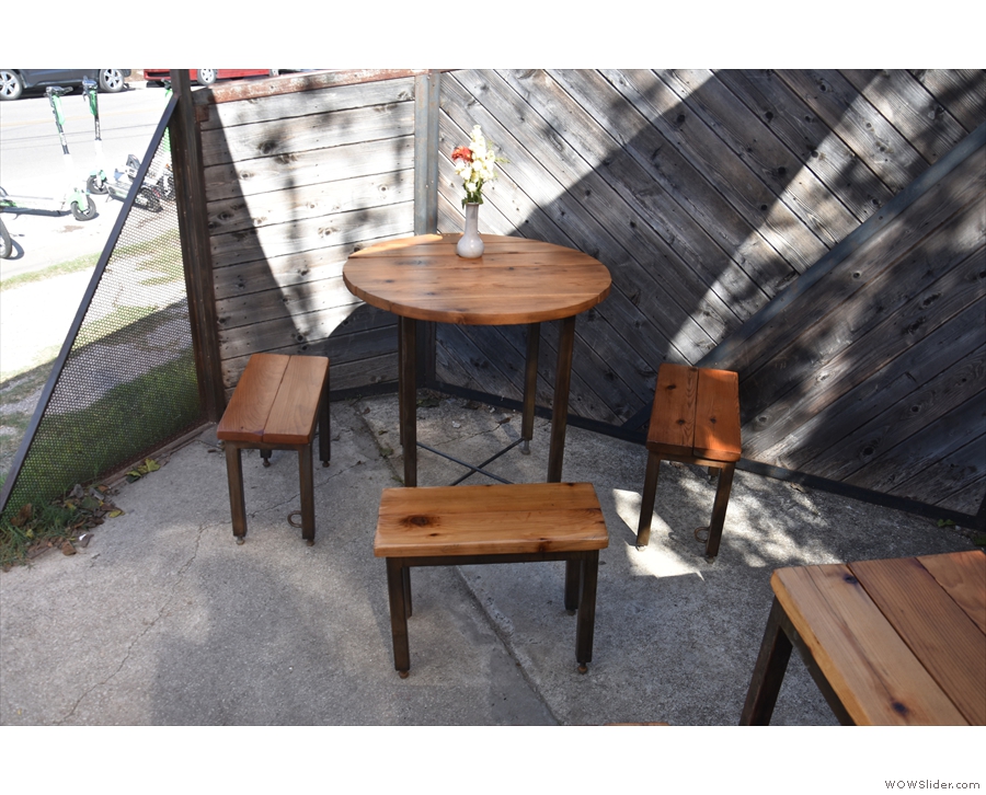 ... or beyond that on the left, this three-person table with low stools.
